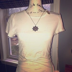 White Michael Kors form fitting t-shirt.